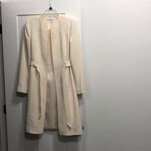 Calvin Klein cream colored lined knee length coat size 6